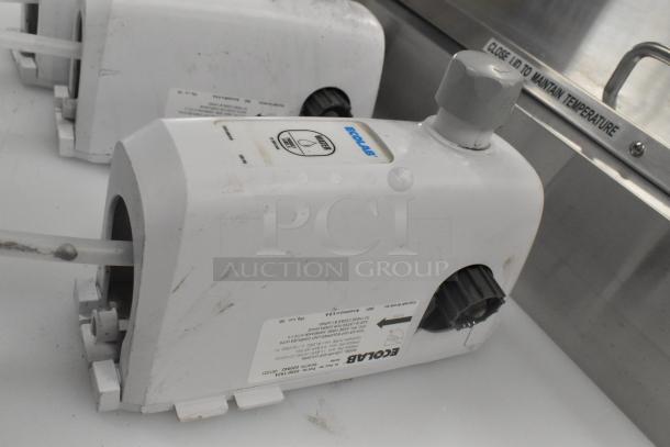 Ecolab LDS-AIR GAP dispensers, 3 units. Features water test indicator, visible wear. Labeled for maintenance.