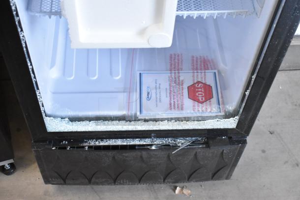 KoolMore MDR-9CP commercial cooler with broken glass, poly coated racks, 115 volts, 1 phase. Tag and damage visible.