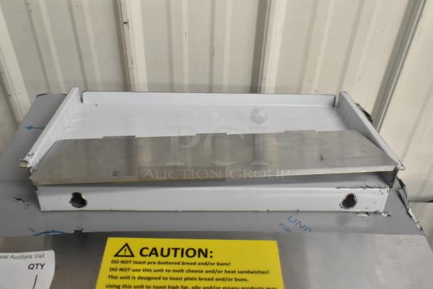BRAND NEW Avantco 184T3600D conveyor toaster, stainless steel, 14.5" wide, 3" opening, 1200 slices/hour, with caution label.