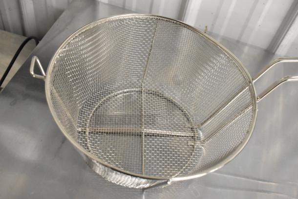 Stainless steel mesh wire basket with dual handles, new condition, minor scratch and dent. Ideal for kitchen use.