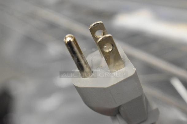 Solwave 180MW1000SS commercial microwave power plug, 120 volts, with standard prongs, close-up view.