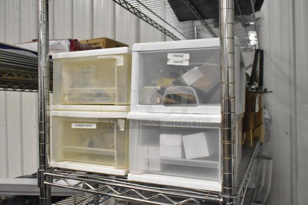 Four clear and white poly bins with contents, labeled "Fridge Lights" and "Blender Parts," on metal shelves.