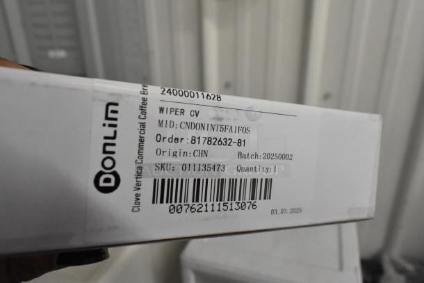 Clear and white poly bins with contents, label reads "Donlim Wiper CV," MID: CNDOIN1T5FA1F0S, SKU: 011135473, Origin: CHN.