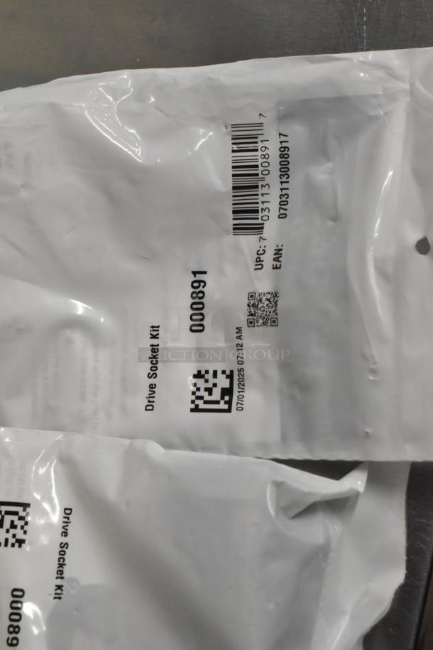 4 poly bins containing drive socket kits, labeled with item code 000891. Each bag displays a UPC and EAN barcode.