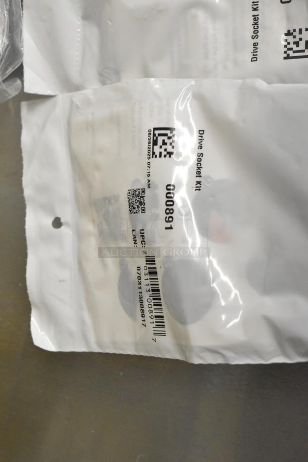 Four clear and white poly bins containing assorted items; visible label reads "Drive Socket Kit", UPC 073713008917.