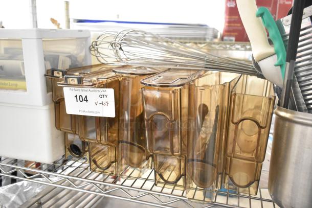 Lot of items including amber poly hoppers, utensils, whisks. Marking: "104 QTY v-lot" from PCAuctions.com.