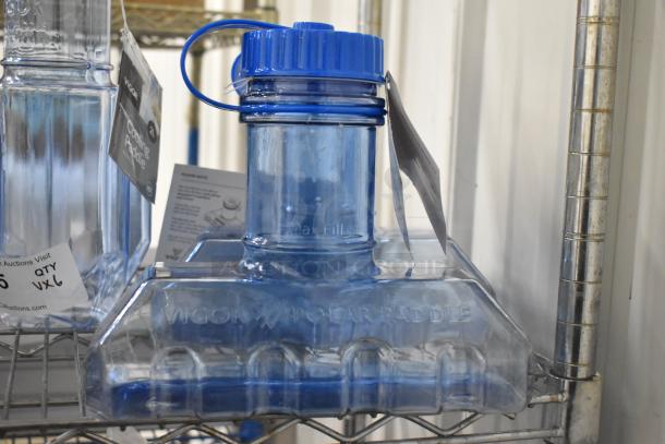 6 blue Poly Rapid Cool bottles with drip tray, Vigor brand, on metal rack. Tags detail cooling function and auction specifics.