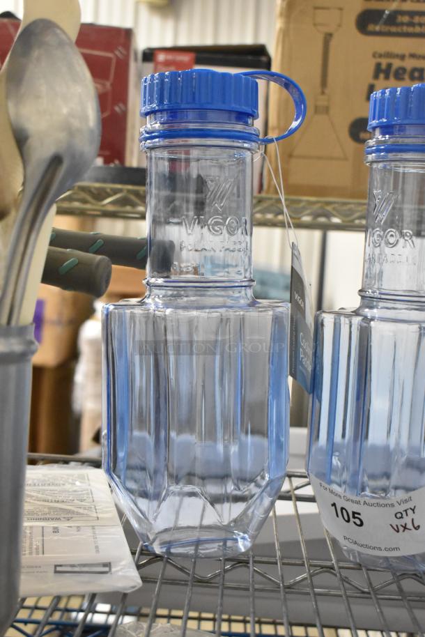Six blue Vigor Poly Rapid Cool bottles with drip tray, mint condition, labels indicate 6x winning bid.