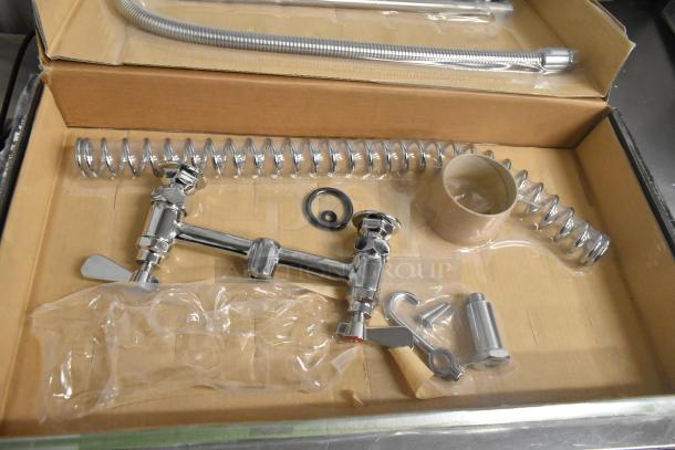Brand new scratch and dent Regency 600PRD8X pre-rinse faucet, 1.15 GPM, deck-mounted with 8" centers and 44" hose.