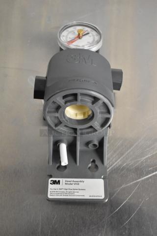 BRAND NEW 3M filter head with shroud and gauge, model 6213001; 3/8" FNPT, scratch and dent. 3M logo visible.