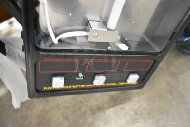 Bunn FMD-3 commercial cappuccino machine, brand new with minor scratches. Features 3 hoppers, metal finish, 120V, 1 phase.