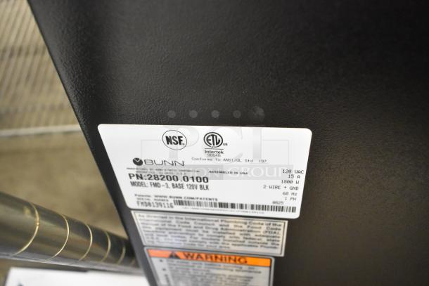 Bunn FMD-3 commercial cappuccino/espresso machine label. NSF and ETL certified, 120V, 1800W. Model details visible.
