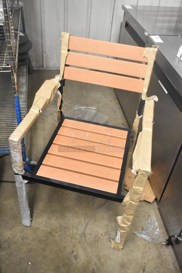 Brand new Lancaster black metal ladder chair with wooden backrest and slat seat. Scratch and dent condition, wrapped in protective material.