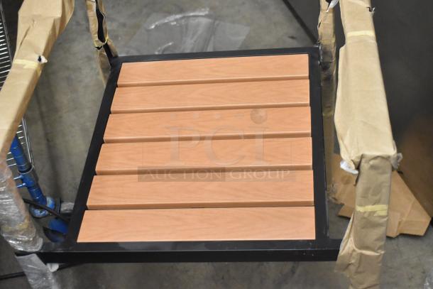 Brand new Lancaster Table & Seating chair with black metal ladder frame, wooden slat seat. Packaged for auction.