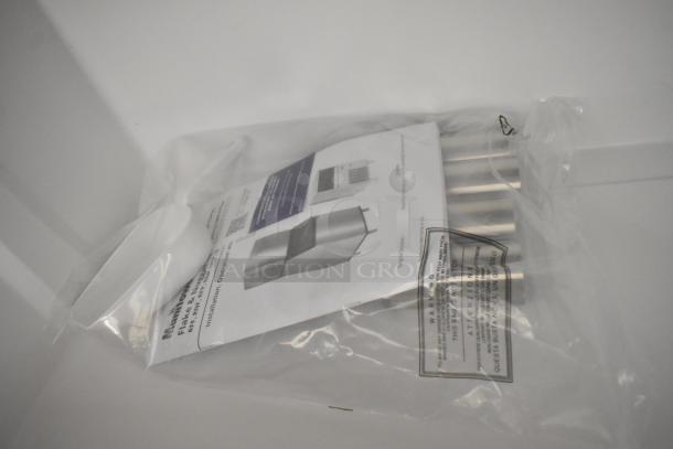 Brand new Manitowoc UNP0300A-161 ice machine manuals in sealed bag, highlighting model and safety information.