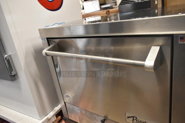 Peerless C131P stainless steel pizza oven, new with scratches. Commercial quad-deck, natural gas, 30,000 BTU, stuck door.
