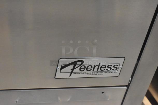 Brand new Peerless C131P stainless steel pizza oven, 30,000 BTU, door stuck closed, scratch and dent condition, visible label.