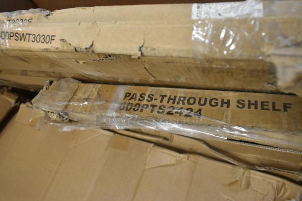 Cardboard boxes labeled "Pass-Through Shelf" 600PTS2424 and "00PSWT3030F", showing signs of minor damage.