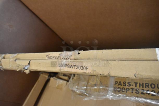 Cardboard packaging of new scratch and dent items, featuring visible product codes 600PSWT3030F and 600PTS2430F.