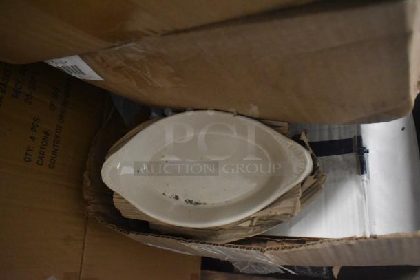 14 new ceramic casserole dishes with minor scratches in original packaging, includes BNRB20 nestable basket.