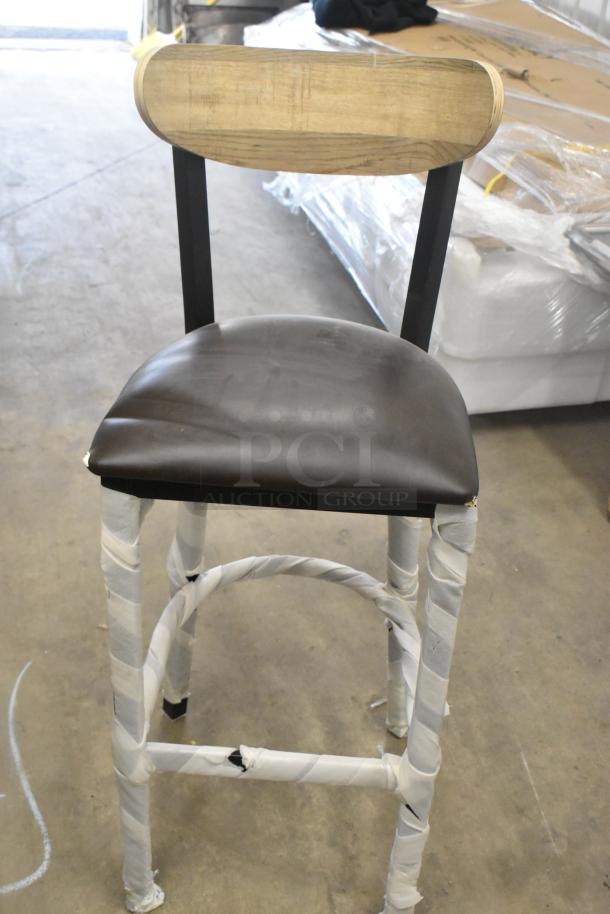 Brand new scratch and dent black metal chair with wooden backrest and cushioned seat, wrapped legs, auction set of 14.