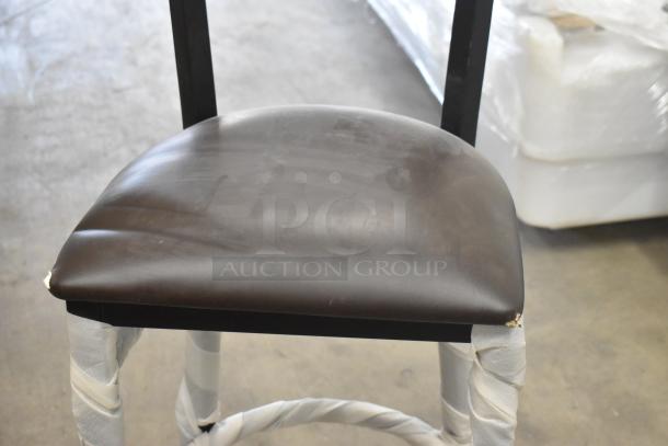 14 new black metal chairs with wooden backrest and cushioned seat. Includes dining and bar height, minor scratches visible.