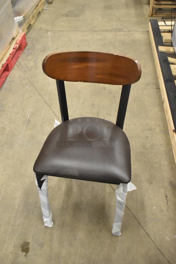 Black metal chair with wooden backrest and cushioned seat, brand new with minor scratches. Dining and bar height options.