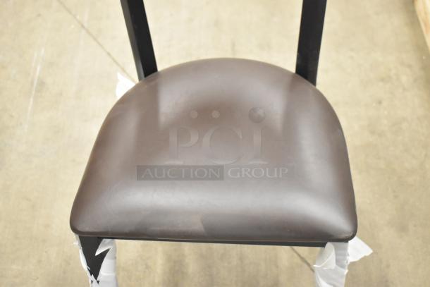 Black metal chair with wooden backrest and cushioned seat. New, scratch and dent condition. Dining and bar height.