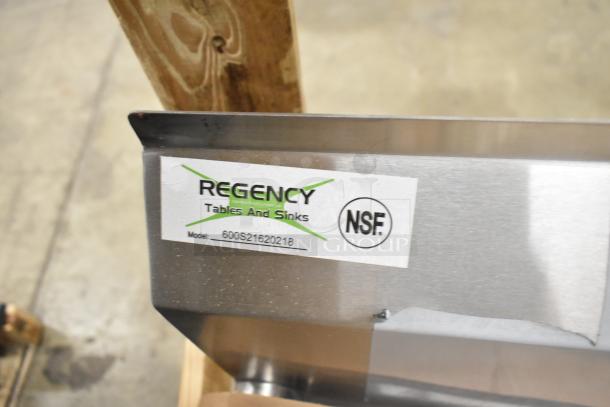 Regency 600S21620218 stainless steel 2-bay sink with dual drain boards, NSF certified, new condition in crate.