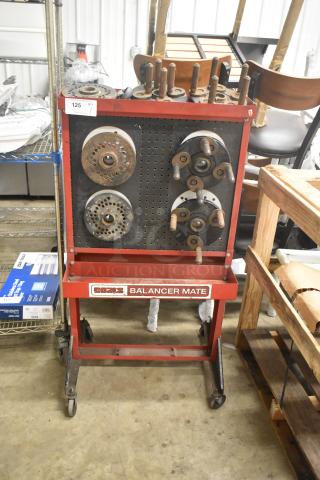 Coats Red Metal Floor Style Balancer Mate on casters, features various metal attachments, label reads "Balancer Mate", in used condition.