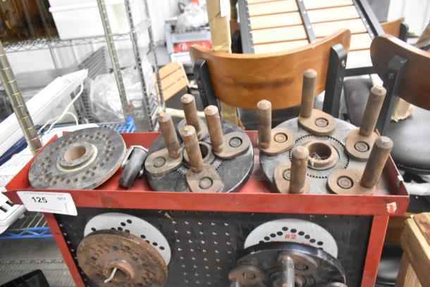 Coats red metal floor-style balancer mate on casters, showing multiple metal balancing components. Good condition.