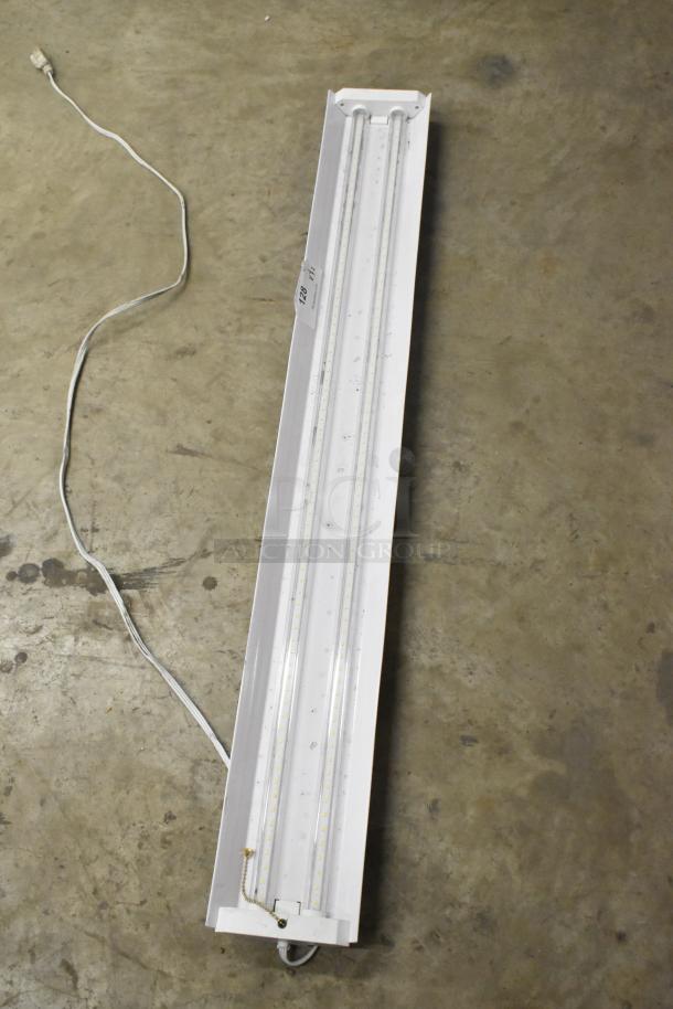 Westinghouse RMSP501D-08 LED shop light, 5000 lumens, new with minor dents, visible tag, pull chain, and power cord.