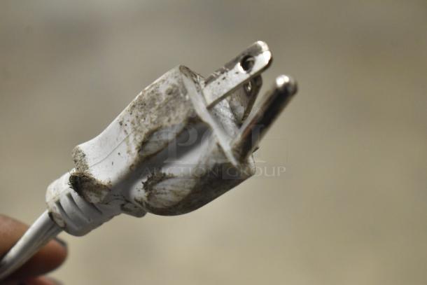 Dirty plug with visible grime and worn condition. Appears used and in need of cleaning.