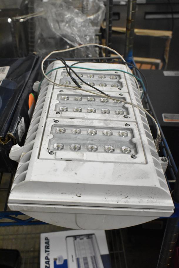 2 brand new items: Westinghouse RMSP501D-08 5000 Lumen LED shop light and Lithonia light. Slightly scratched.