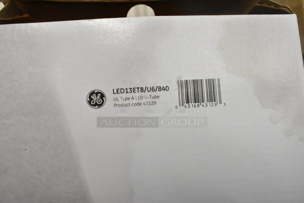 12 new GE LED13ET8/U6/840 Type A U-Tube lights with scratch and dent. Product code 43129 visible on label.