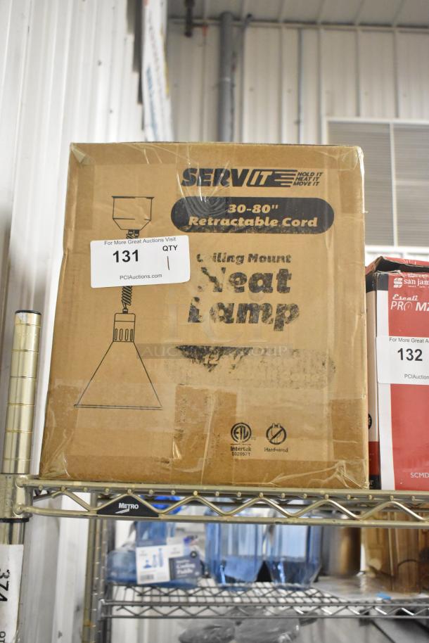 Brand new ServIt 423HLR45BK heat lamp with black round cone shade. 120V, retractable cord. Box shows wear, tags visible.