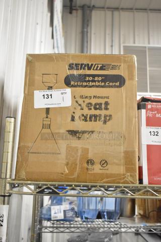 Brand new ServIt 423HLR45BK heat lamp with black round cone shade. 120V, retractable cord. Box shows wear, tags visible.