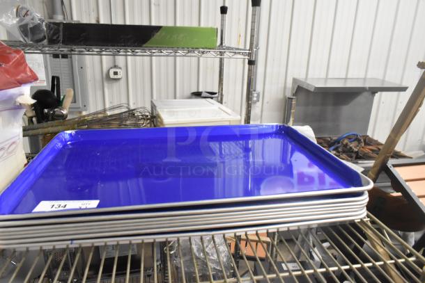 Seven new Choice 407BUNFULL 18"x26" bun pans, 19-gauge aluminum, wire rim. Scratch and dent condition, multipack auction.