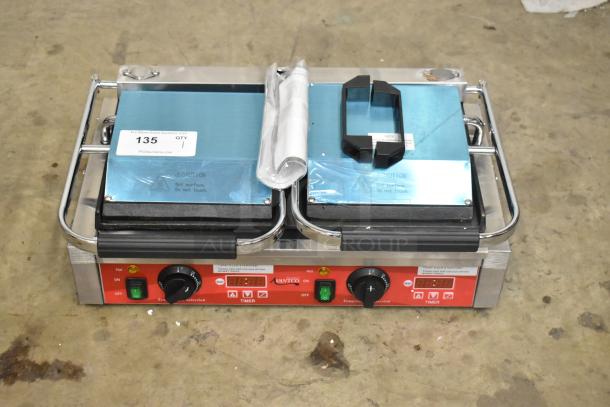 Brand new Avantco 177PG400ST stainless steel dual panini grill. Smooth plates, 19 5/8" x 9 1/8" surface, timer included.