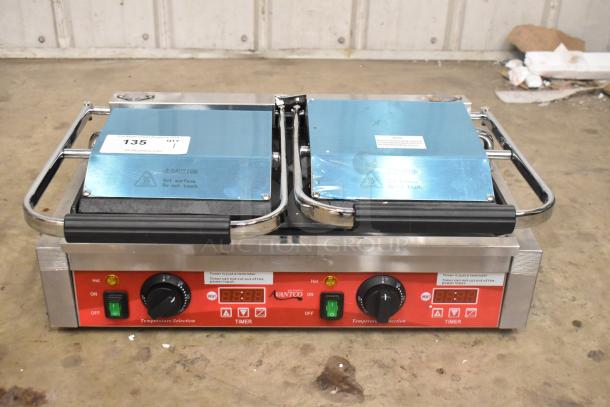 Brand new Avantco 177PG400ST stainless steel dual panini grill with timer, smooth plates, 19 5/8" x 9 1/8" surface.
