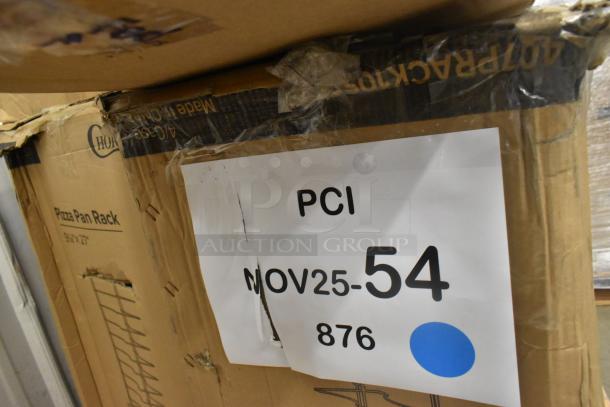 Cardboard box labeled Choice 407PRACK10SO, showing slight damage. "Pizza Pan Rack, 9'x27'" text visible. Tag reads "PCI NOV25-54 876."