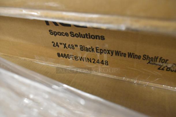 Cardboard box with label "24''x48'' Black Epoxy Wire Wine Shelf." New scratch and dent items, including wire shelves, visible.