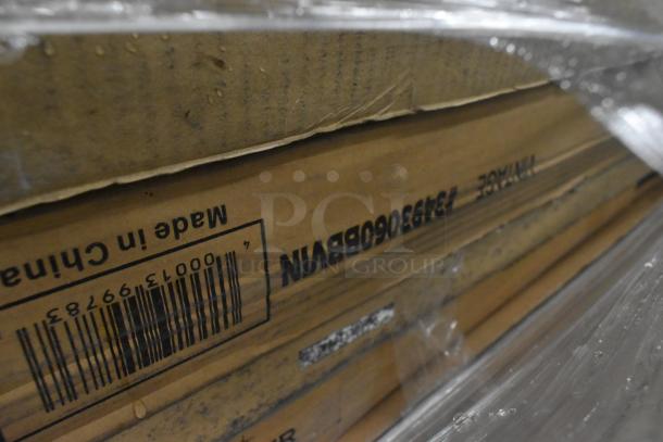 Cardboard packaging of scratch and dent items, labeled "Made in China" with visible barcode. Contains wire shelves and butcher block tabletop.