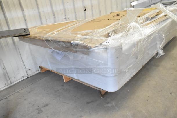 Five brand new scratch and dent items including a 600TS3696S Regency 36"x96" stainless steel work table, wrapped and on a pallet.