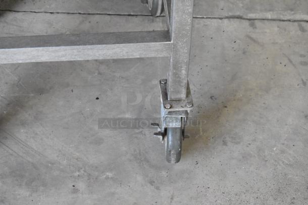 Close-up of a commercial caster wheel from a 2016 Turbochef HhC2020 conveyor oven.