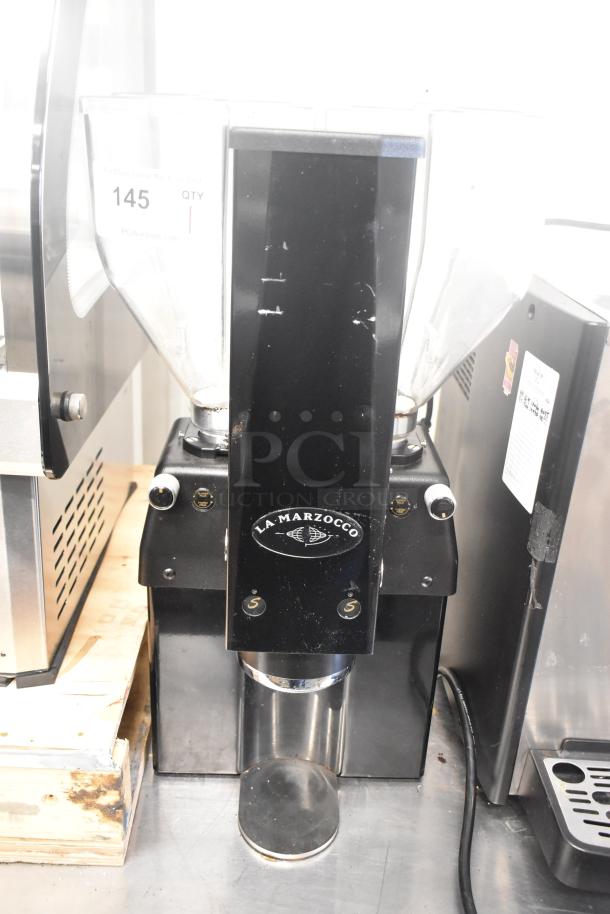 La Marzocco Swift E.P.S.B. commercial espresso grinder with 2 hoppers, black metal finish, 120V, 1 phase, visible minor wear.