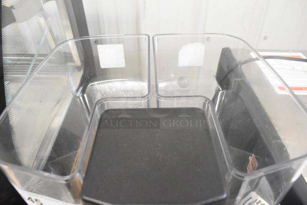 La Marzocco Swift E.P.S.B. espresso grinder with dual hoppers, metal body, and visible commercial use, 120V, 1 phase.