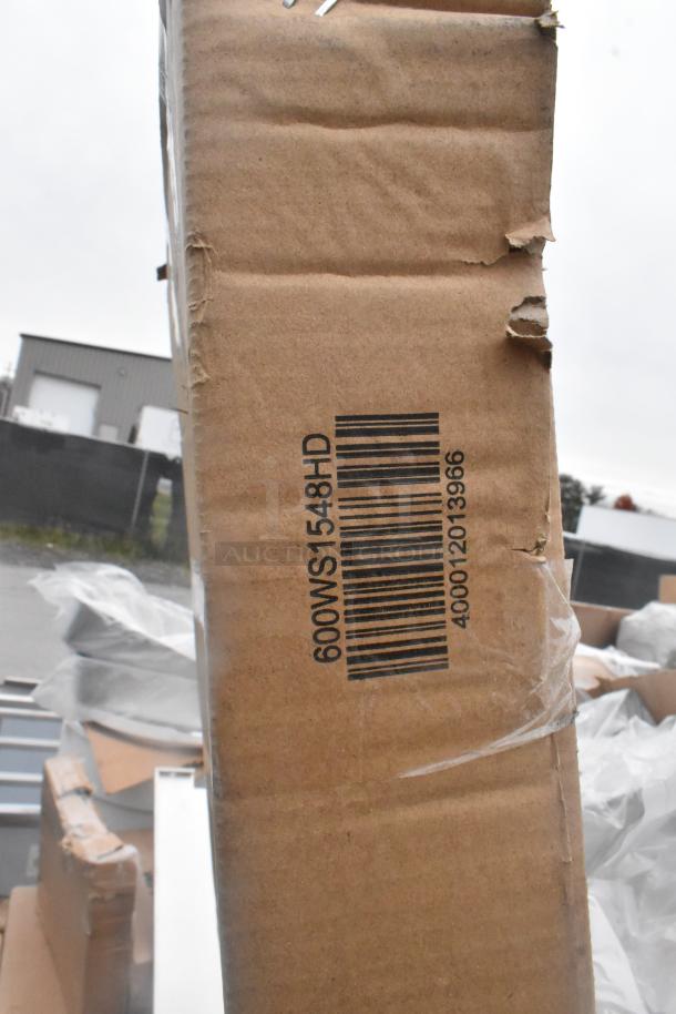 Cardboard box with barcode 600WS1548HD. Box has minor wear and visible dents, part of a scratch and dent auction lot.
