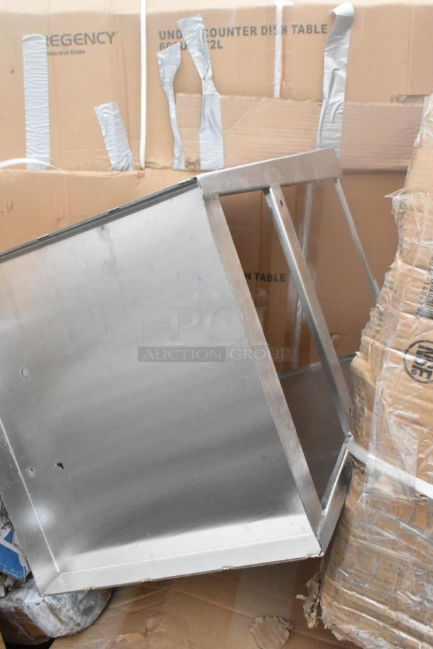 12 new scratch-and-dent items including a Regency under-counter dish table. Mint condition in packaging.