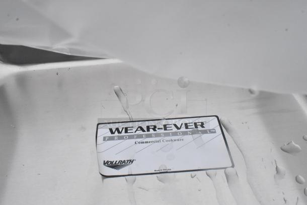 Wear-Ever Professional cookware label on a stainless steel surface indicating commercial quality by Vollrath.